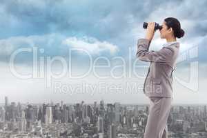 Composite image of portrait of a happy businesswoman looking thr