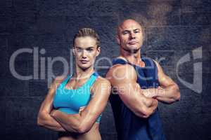 Composite image of portrait of confident strong man and woman