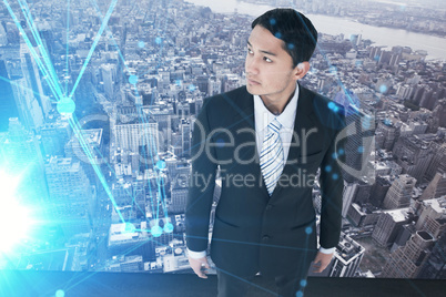 Composite image of serious asian businessman