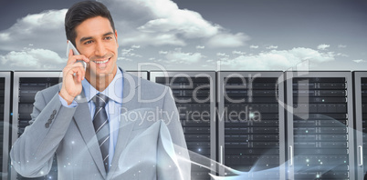 Composite image of businessman using mobile phone with colleague