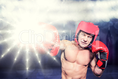 Composite image of boxer punching against black background