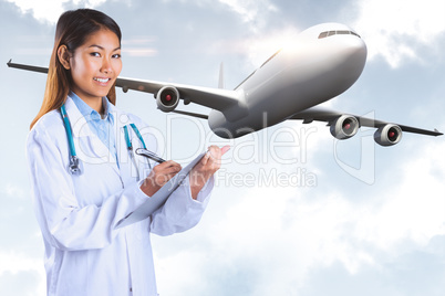 Composite image of asian doctor writing on files