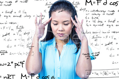 Composite image of worried businesswoman holding her head