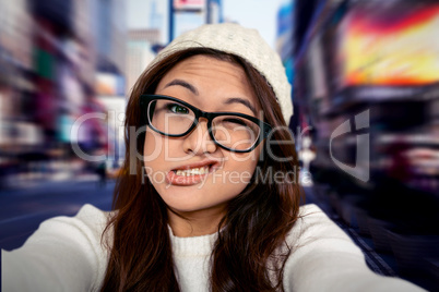 Composite image of asian woman making faces