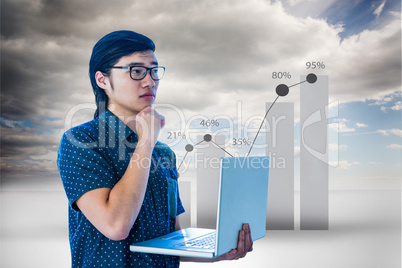 Composite image of thoughtful hipster using his laptop