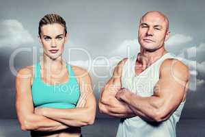 Composite image of portrait of athlete man and woman with arms c