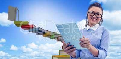 Composite image of asian businesswoman using tablet