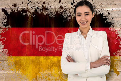 Composite image of smiling businesswoman looking at the camera