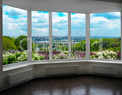 plastic window with view of Kyiv in spring
