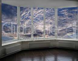 plastic windows overlooking the sunset with clouds