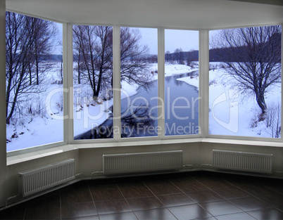 windows of room overlooking the winter river