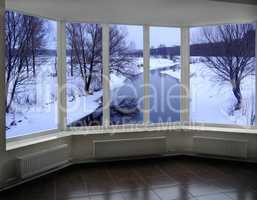 windows of room overlooking the winter river