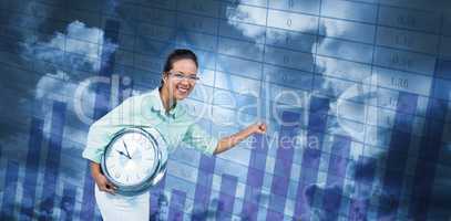 Composite image of delighted businesswoman holding a clock