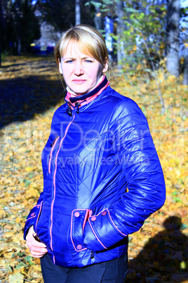 modern fashionable woman in blue jacket