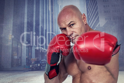 Composite image of portrait of boxer with fighting stance