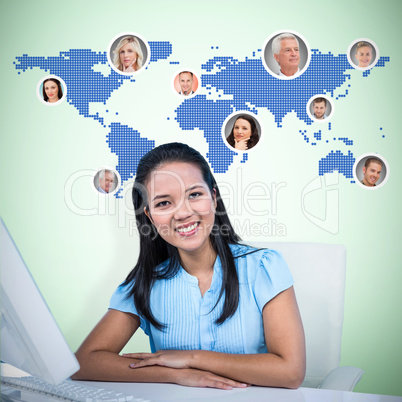 Composite image of smiling businesswoman with arms crossed