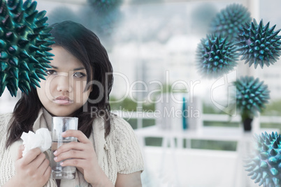 Composite image of sick woman holding a tissue and a glass of wa