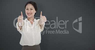 Composite image of business colleagues gesturing thumbs up in of