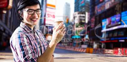 Composite image of smiling creative businessman with take-away c