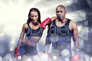 Composite image of portrait of confident boxers