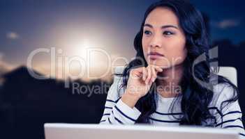Composite image of thoughtful asian woman with finger on chin