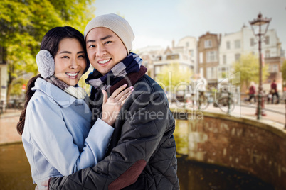 Composite image of portrait of couple embracing