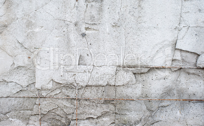 Texture cement wall of destroyed construction with fittings