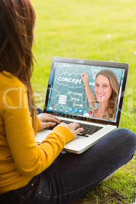 Composite image of woman using laptop in park