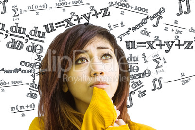 Composite image of beautiful young woman looking away in park