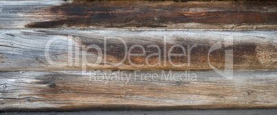 Background texture wall of wooden logs. Weathered pine planks
