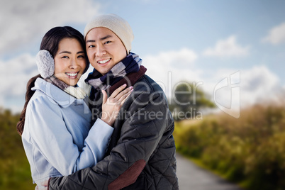 Composite image of portrait of couple embracing