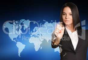 Woman in suit drawing on world map virtual space