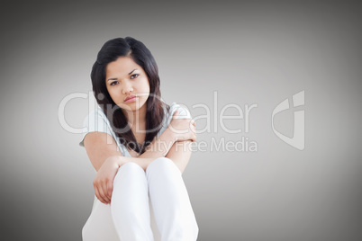 Barefoot woman sitting on the floor