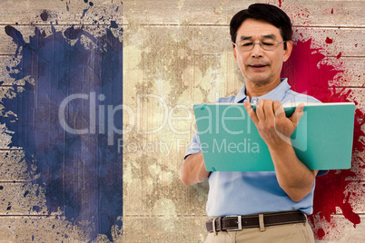 Composite image of elderly man holding a green folder