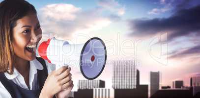 Composite image of businesswoman shooting through a megaphone