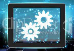 Tablet with gears on abstract background communications network