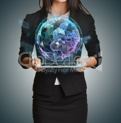 Young girl holding tablet in the hands of virtual digital globe