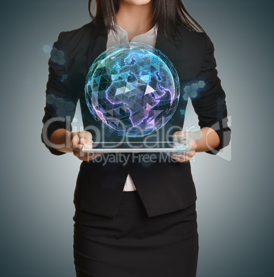 Young girl holding tablet in the hands of virtual digital globe