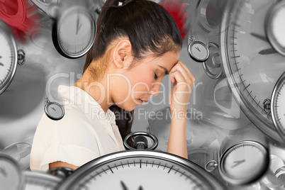 Composite image of casual upset businesswoman with head bowed