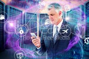 Composite image of businessman using his smartphone
