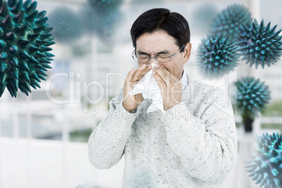 Composite image of smiling man using a tissue