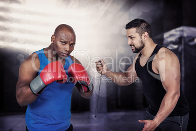 Composite image of strong friends using kettlebells together