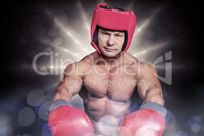 Composite image of portrait of boxer with red gloves and headgea