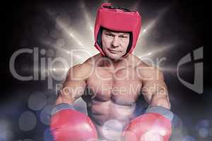 Composite image of portrait of boxer with red gloves and headgea