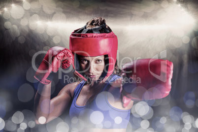 Composite image of portrait of female boxer with gloves and head