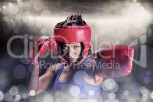 Composite image of portrait of female boxer with gloves and head