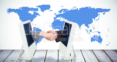 Composite image of close up of two businesspeople shaking their