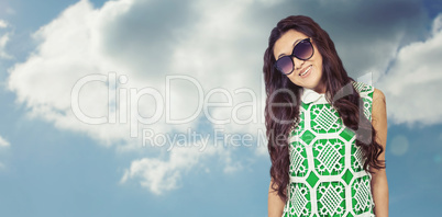 Composite image of asian woman with sunglasses posing for camera