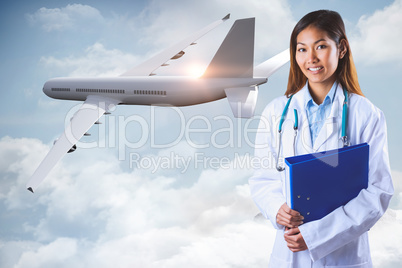 Composite image of asian doctor holding blue binder