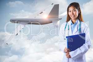 Composite image of asian doctor holding blue binder